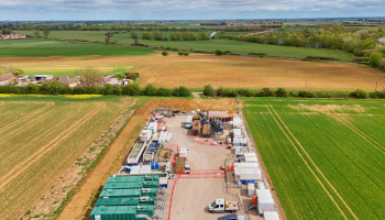 Aerial shot showing drilling area, and fields beyond