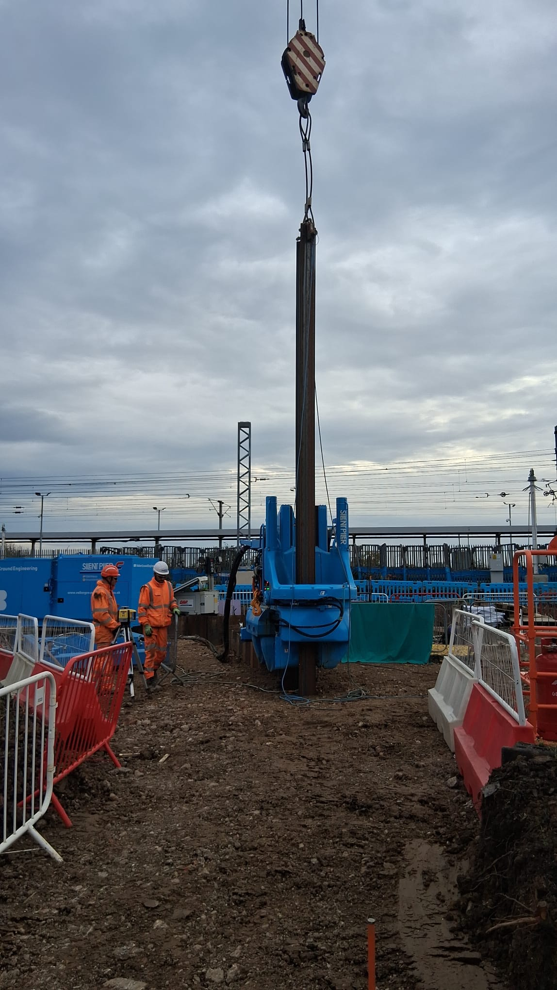 Two people stood next to a supercrush rig.